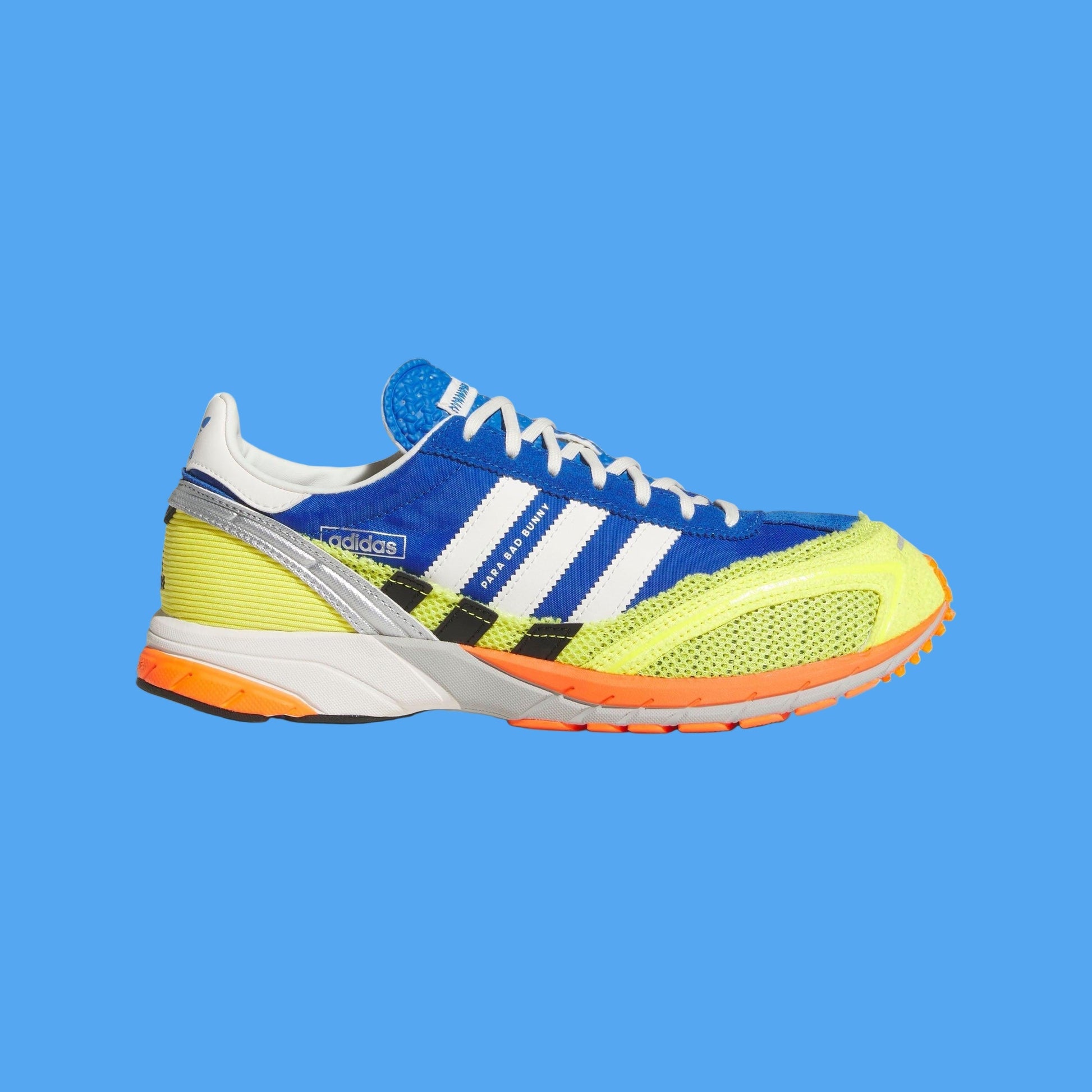 Colorful Adidas sneaker with blue, yellow, and orange accents on a light gray background