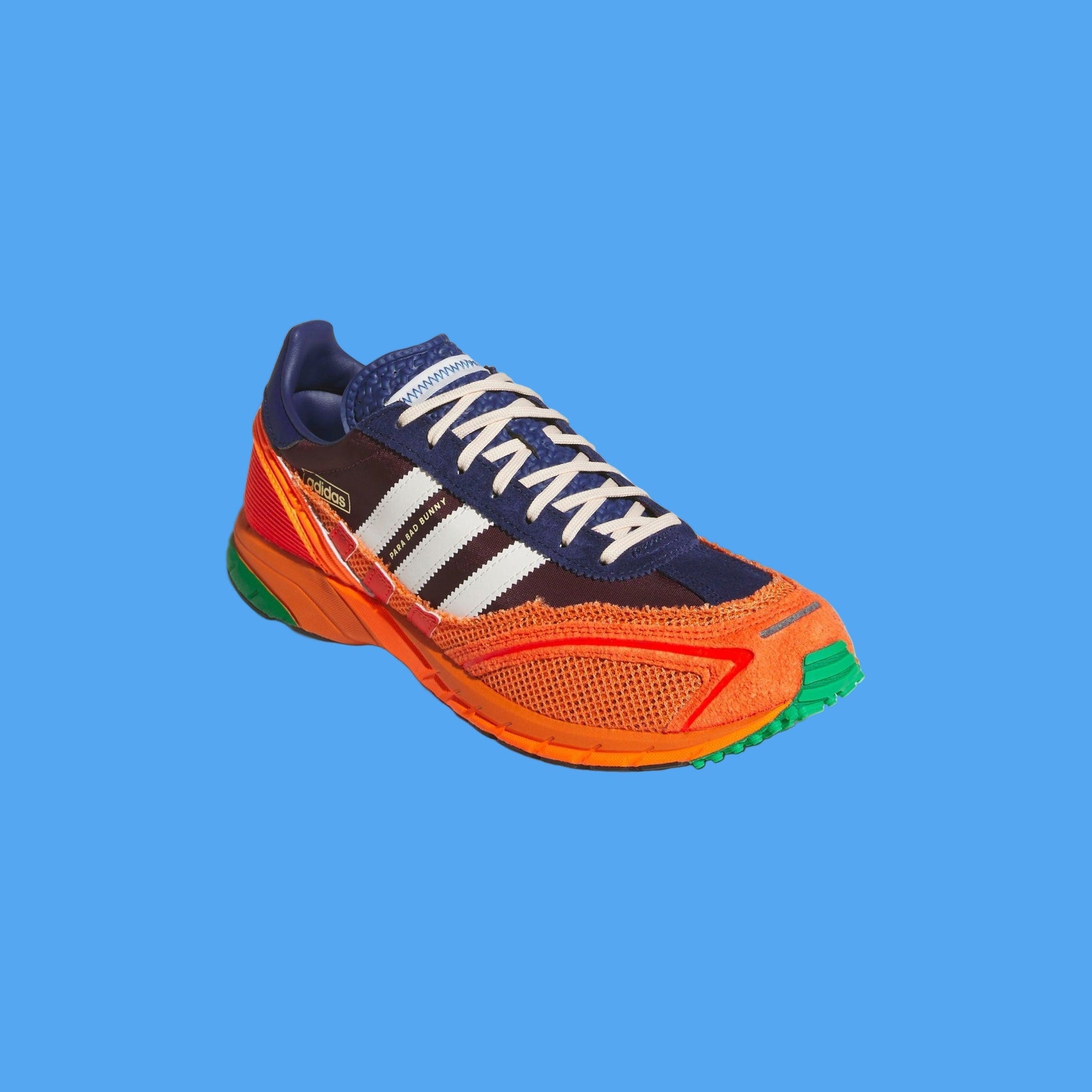 Colorful running shoe with orange sole and blue accents on a light gray background